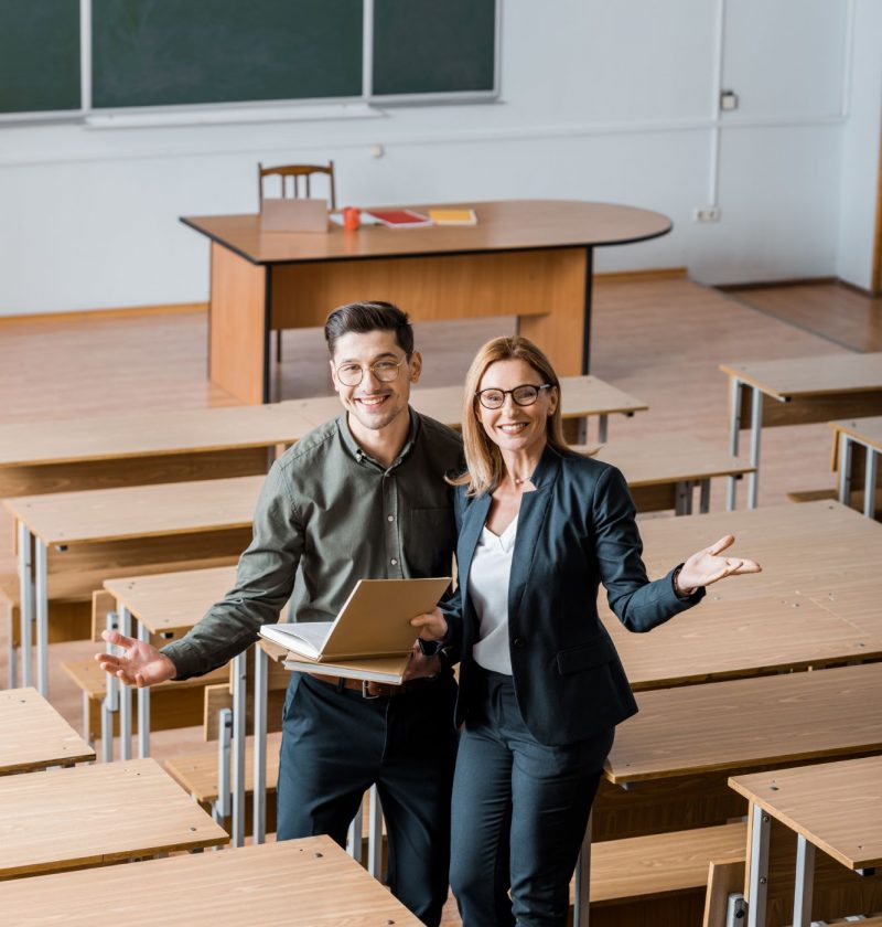 happy-male-student-and-female-teacher-with-outstre-2023-11-27-05-11-27-utc (1)