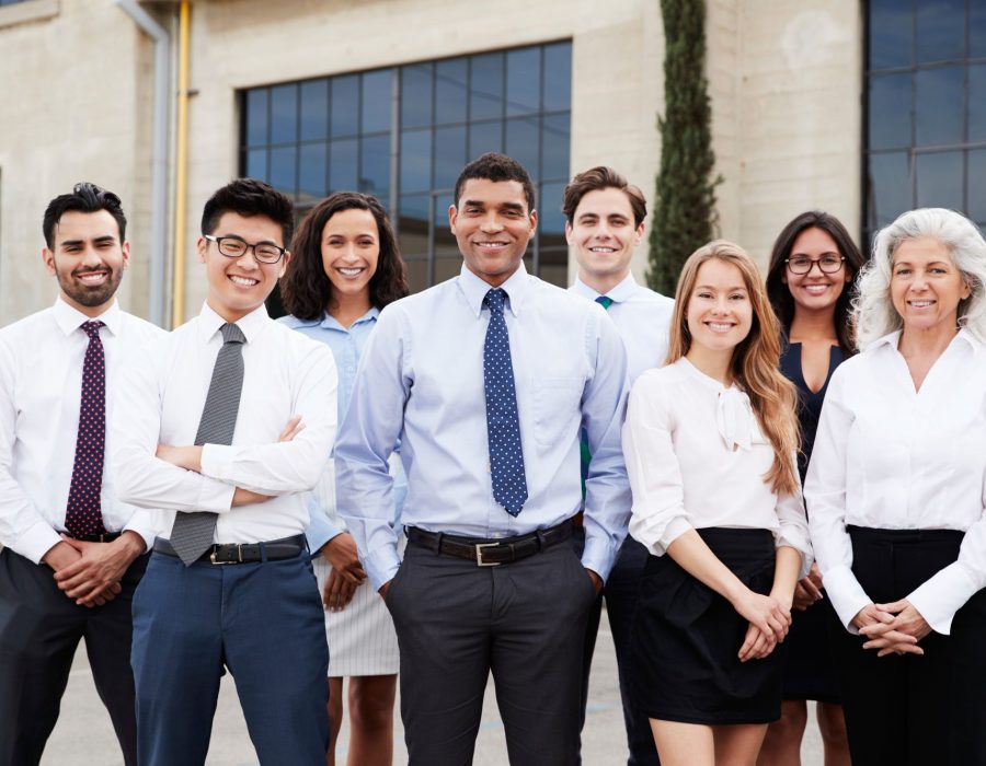 mixed-race-businessman-and-colleagues-outdoors-po-2024-10-19-11-15-12-utc (1)